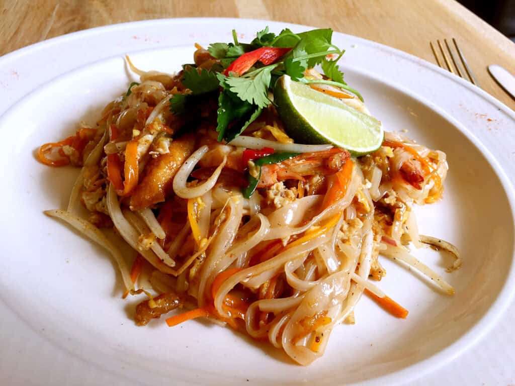 Delicious spicy Asian noodle stir-fry with vegetables and herbs.