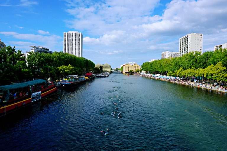 Bassin de la Villette - Take a stroll in the Canal St-Martin, enjoy exploring this picturesque and trendy district. Explore the banks of the canal, restaurants, bars, shops and other things to do and see. #Paris #CanalStMartin #France