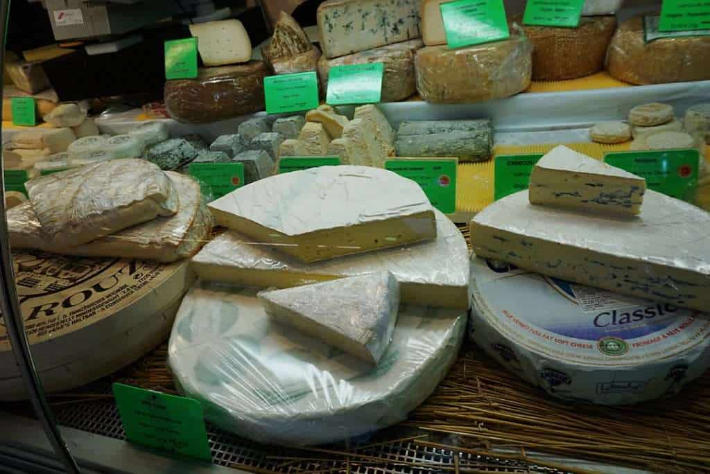 20 Reasons to love France. France is one of the most visited countries in the world. From the fantastic gastronomy (think croissants, baguettes, cheese and wine), the language to the stunning scenery, there are many reasons to love France. #France #Bastille Day #Explore #Travel Assorted French cheese platter from local markets - Reasons to Love France