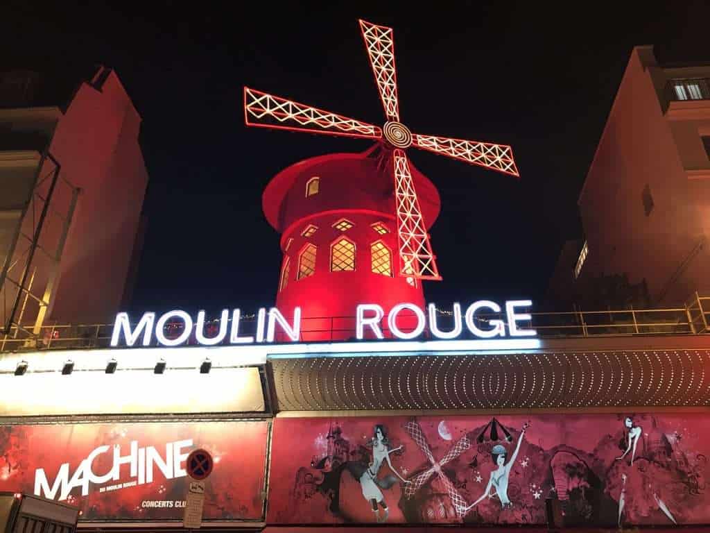 20 Reasons to love France. France is one of the most visited countries in the world. From the fantastic gastronomy (think croissants, baguettes, cheese and wine), the language to the stunning scenery, there are many reasons to love France. #France #Bastille Day #Explore #Travel Moulin Rouge cabaret lights in Paris - Reasons to love France