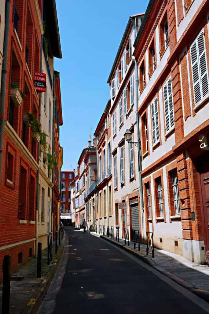 France Travel Guide: Regions, Itineraries & Hidden Gems 13 Picturesque street in the Old Town of Toulouse, the Pink City
