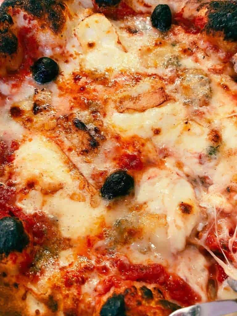 Amazing Things to do in and around Lake Annecy, France 20 Delicious pizza with olives and local cheese