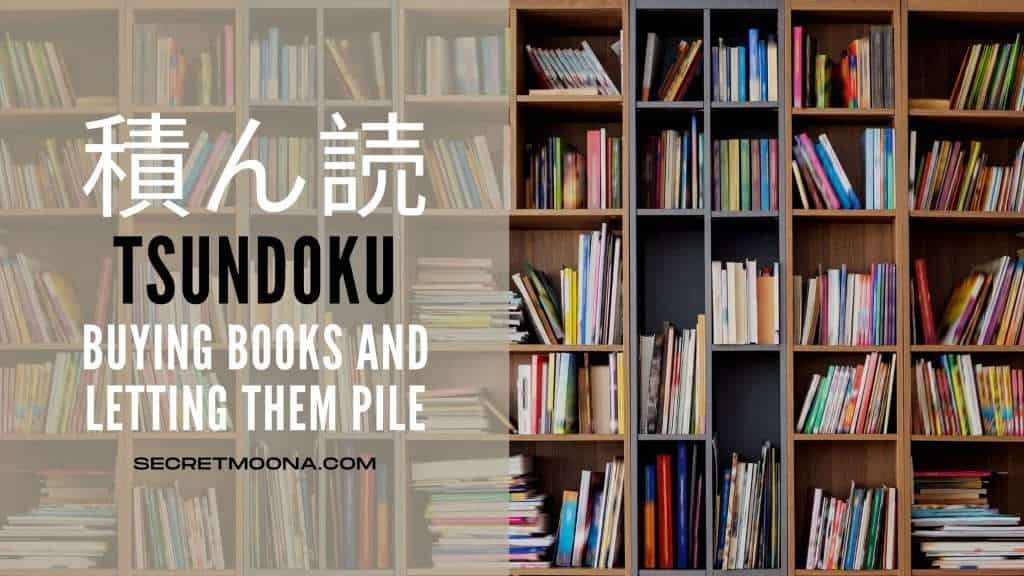 Tsundoku (積ん読), buying books and letting them pile up, shown beside tall wooden shelves crammed with unread books