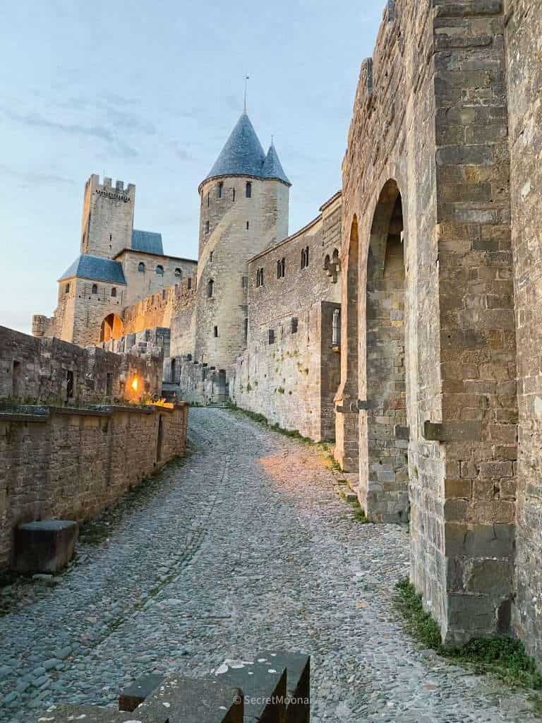 Cobbled lane along the ramparts of the Cité de Carcassonne at dusk