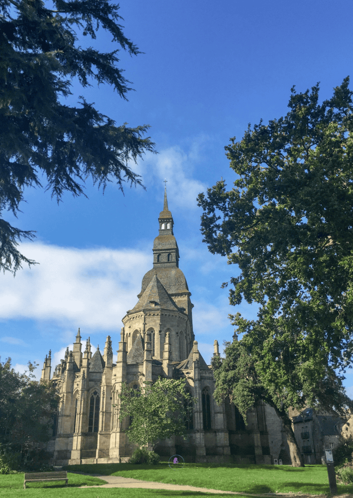 Things To Do In Brittany, France: A Journey Through Scenic Landscapes, And Authentic Culture. 16 Detailed exterior of Basilique Saint-Sauveur, a historic church located in Dinan, Brittany France.