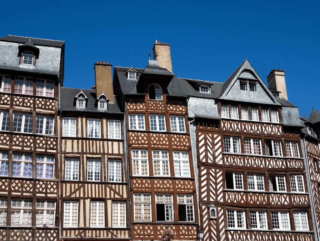 Things To Do In Brittany, France: A Journey Through Scenic Landscapes, And Authentic Culture. 24 Half-timbered buildings of historic Rennes, Brittany Northen France, against clear blue sky