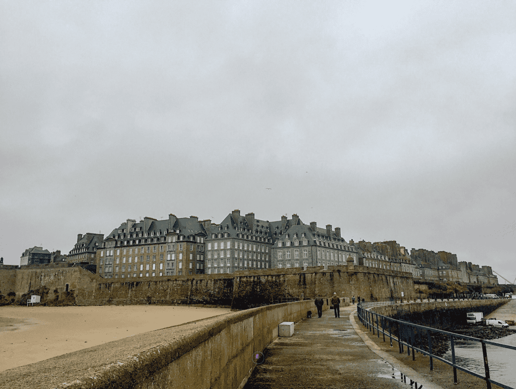 Things To Do In Brittany, France: A Journey Through Scenic Landscapes, And Authentic Culture. 8 Scenic view of the historic walled city of St Malo in France, with the sea surrounding the fortified town.