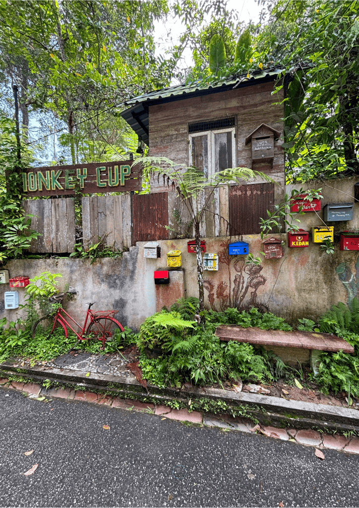 House in Penang, Malaysia with colourful letter boxes.