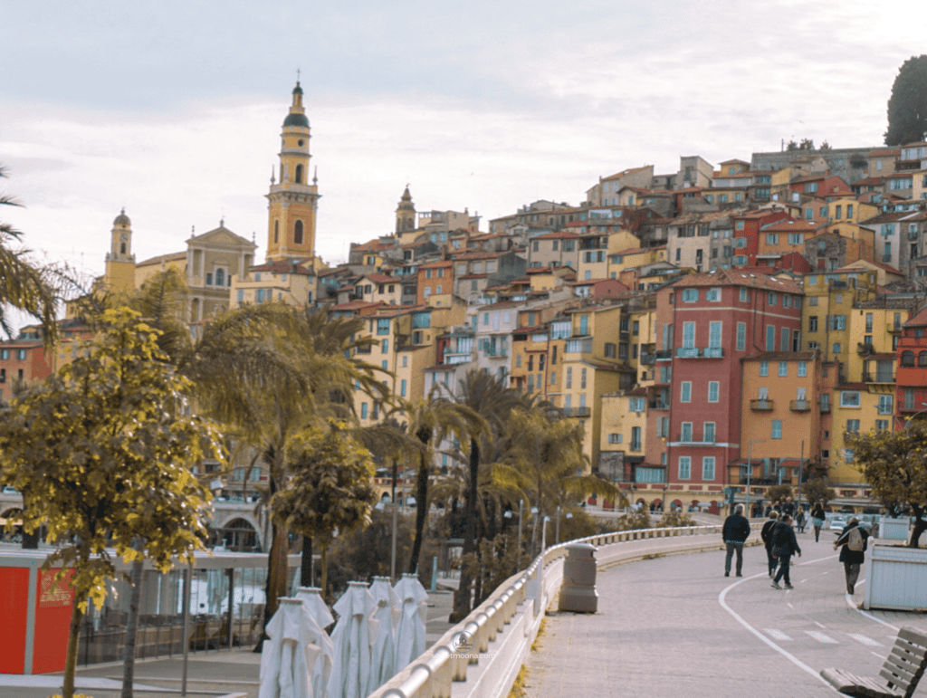 The Perfect One Day in Menton Itinerary: Discover Hidden Gems 16 Menton's busting skyline featuring numerous tall buildings against a clear blue sky.