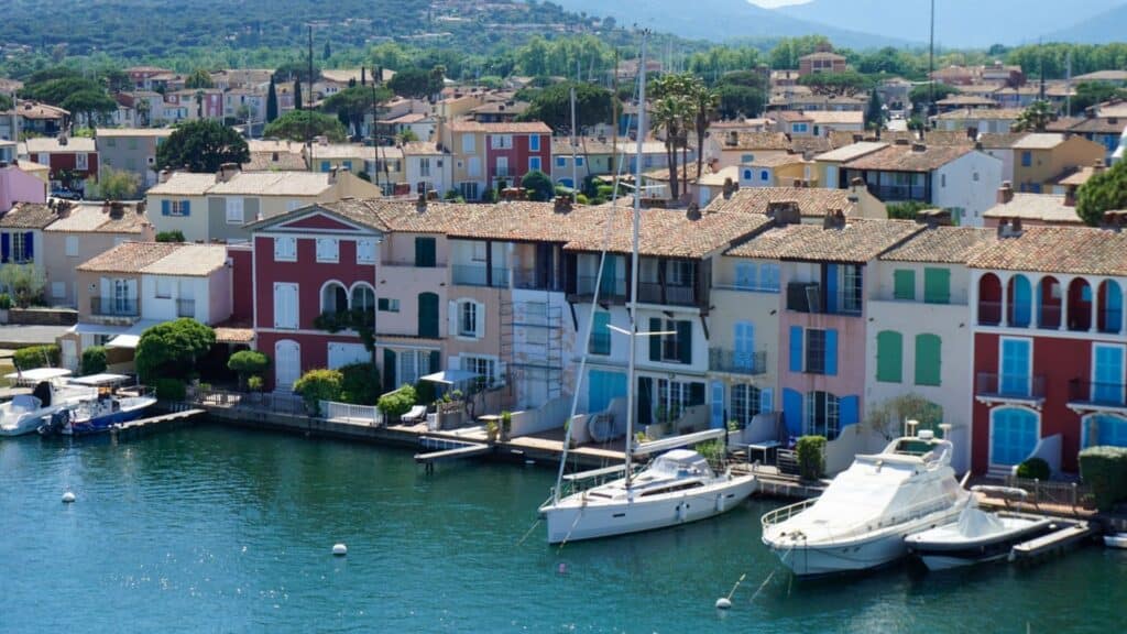 Port Grimaud: The Ultimate Guide to Provence's Little Venice 12 A harbor with many colorful houses and boats in Port Grimaud