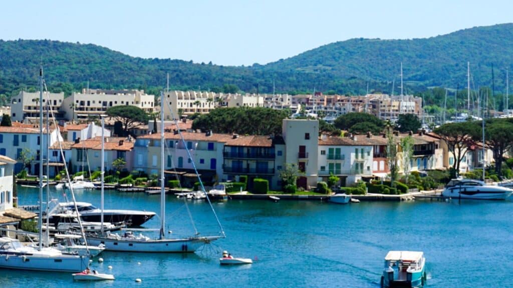 Port Grimaud: The Ultimate Guide to Provence's Little Venice 18 A marina with many boats in it and houses in Port Grimaud
