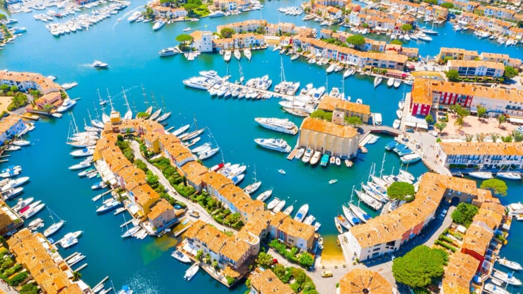 Port Grimaud: The Ultimate Guide to Provence's Little Venice 8 Aerial view of Port Grimaud during summer - Port Grimaud, France