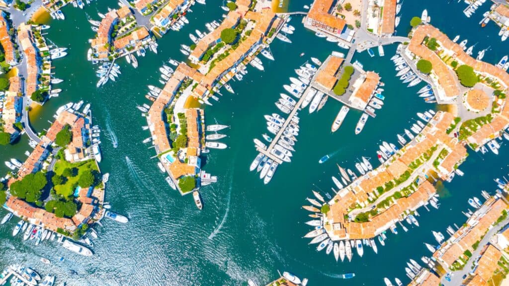 Port Grimaud: The Ultimate Guide to Provence's Little Venice 10 View Of Colourful Houses And Boats In Port Grimaud During Summer - Port Grimaud, France