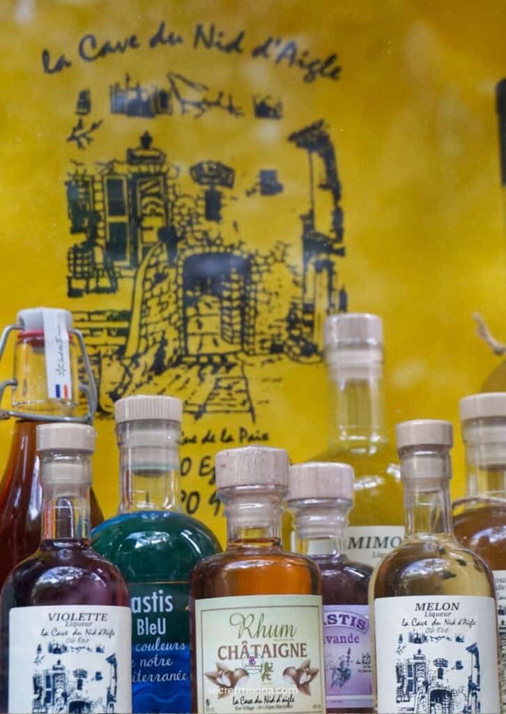 Discover Èze Village: The Most Beautiful Village in Southern France 30 Liqueur bottles at La cave du Nid d'Aigle shop Eze Village France