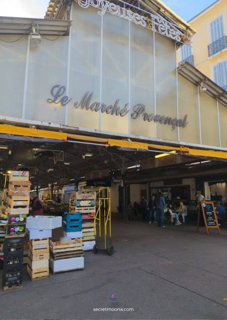 Local Provençal market stalls in Antibes selling olives, spices, and fresh produce