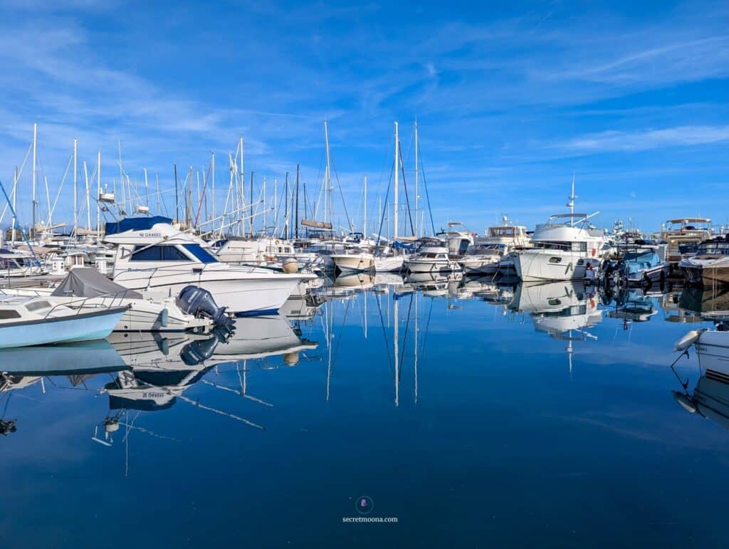 Luxury yachts and sailboats moored at Port Vauban marina in Antibes.