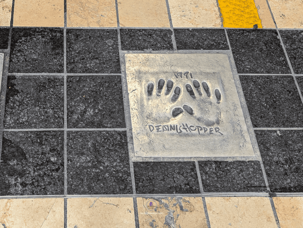 Handprints embedded in the pavement