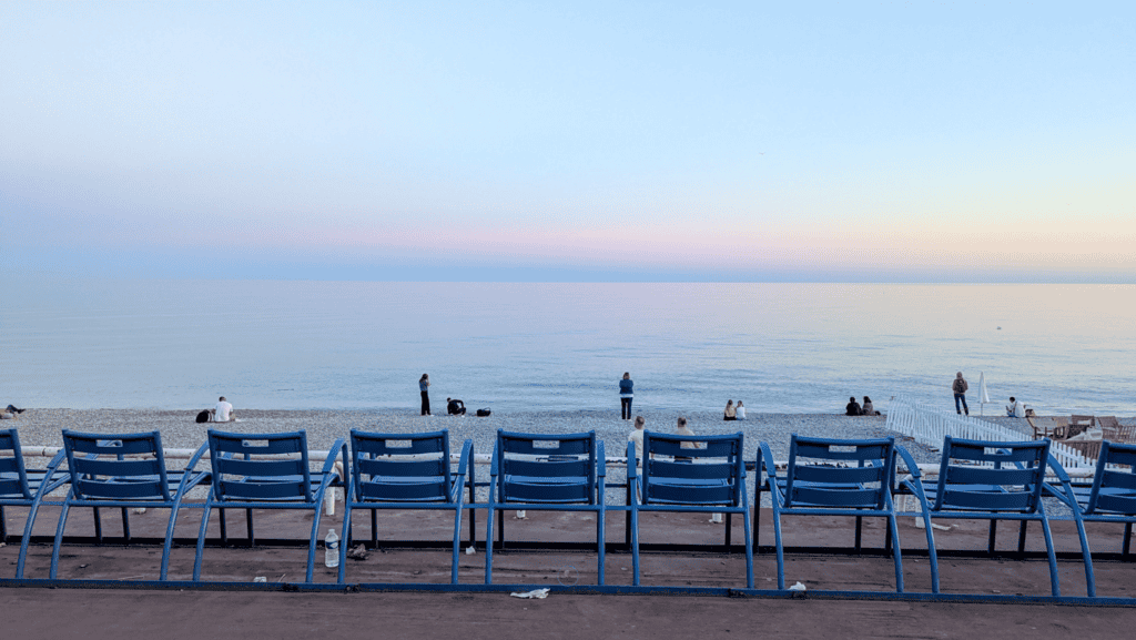 How To Spend One Day In Villefranche-sur-Mer: Things To Do 20 Blue chairs on the Promenade des Anglais in Nice overlooking the Mediterranean Sea