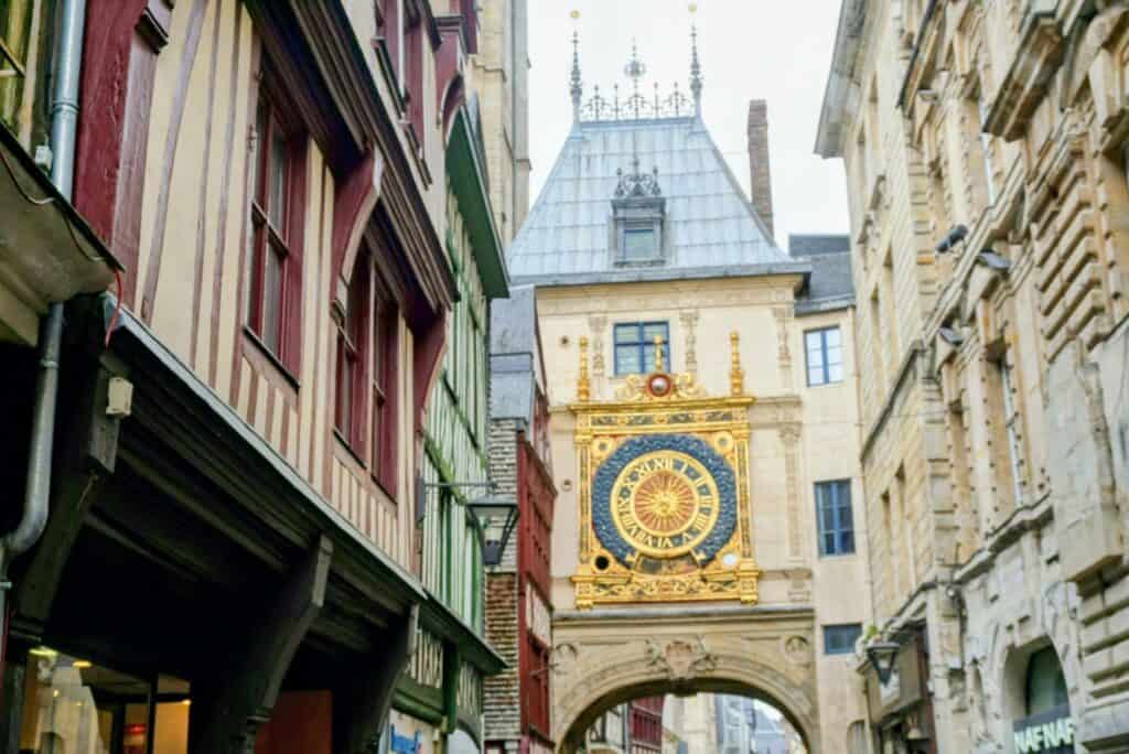 Beautiful Medieval Towns in France for History Lovers 8 Gros-Horloge astronomical clock framed by half-timbered houses in medieval Rouen