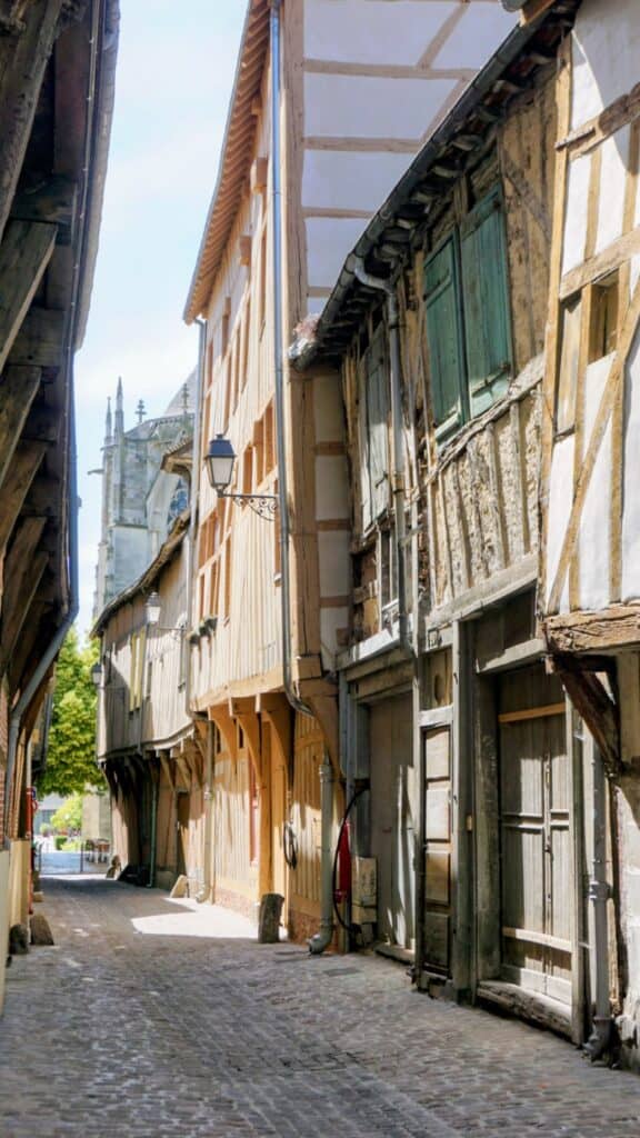 Beautiful Medieval Towns in France for History Lovers 10 Narrow cobbled lane with colourful half-timbered houses in the historic centre of Troyes