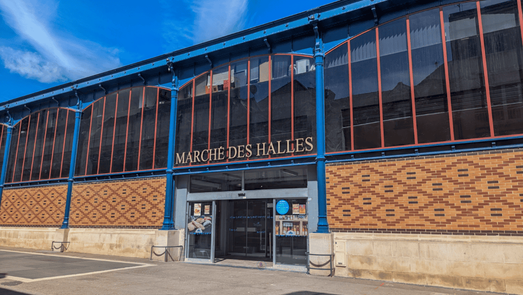Exterior of the Marche des Halles food market in Troyes under a blue sky
