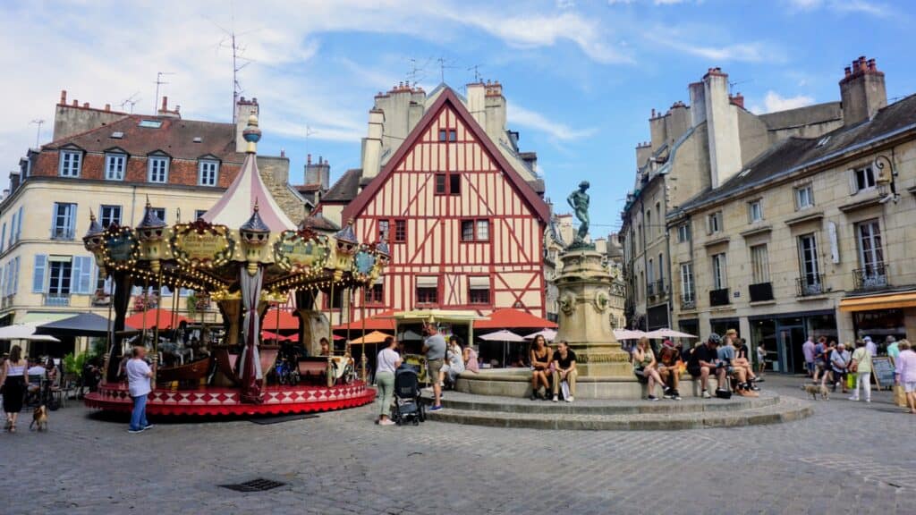 Beautiful Medieval Towns in France for History Lovers 6 Carousel and half-timbered house on Place François Rude in the historic centre of Dijon