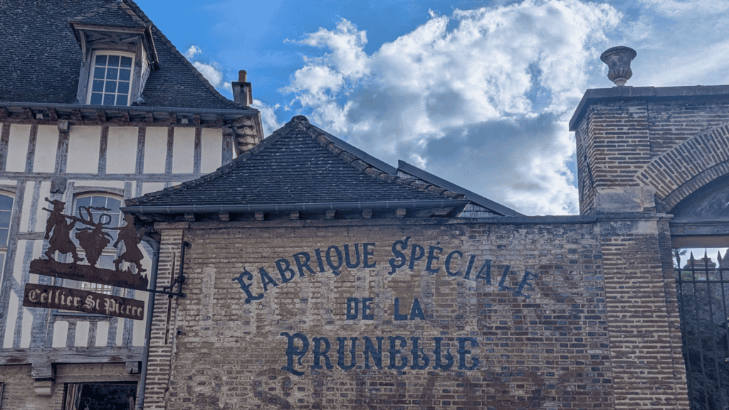Historic brick wall advertising Prunelle liqueur near Cellier Saint-Pierre in Troyes