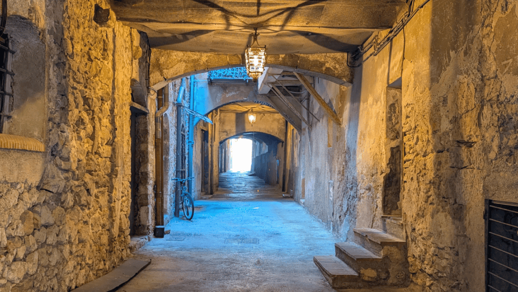 How To Spend One Day In Villefranche-sur-Mer: Things To Do 12 Stone arches inside Rue Obscure medieval covered passage in Villefranche-sur-Mer