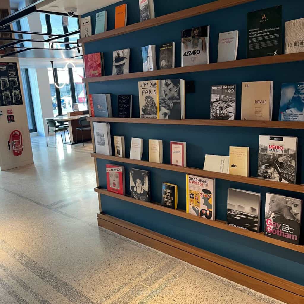 TRIBE Paris Pantin Review: Is This Stylish Hotel Near La Villette Worth It? 10 Art and design books displayed in the lobby at TRIBE Paris Pantin