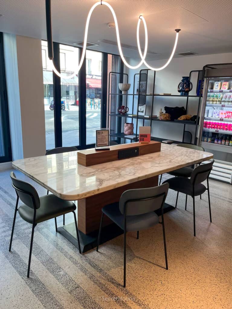 TRIBE Paris Pantin Review: Is This Stylish Hotel Near La Villette Worth It? 14 Communal work table in the lobby at TRIBE Paris Pantin