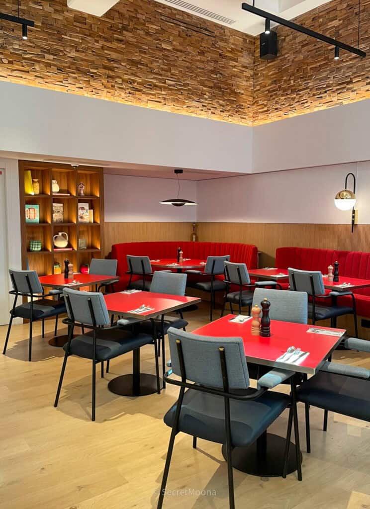 TRIBE Paris Pantin Review: Is This Stylish Hotel Near La Villette Worth It? 12 Restaurant dining room at TRIBE Paris Pantin with red banquette seating