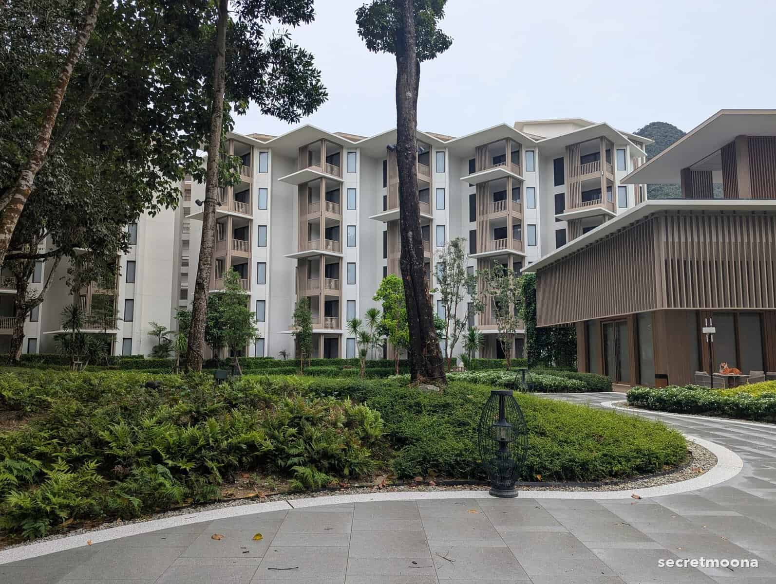 Gardens and curving paths between the low-rise wings of Hilton Burau Bay Langkawi Resort