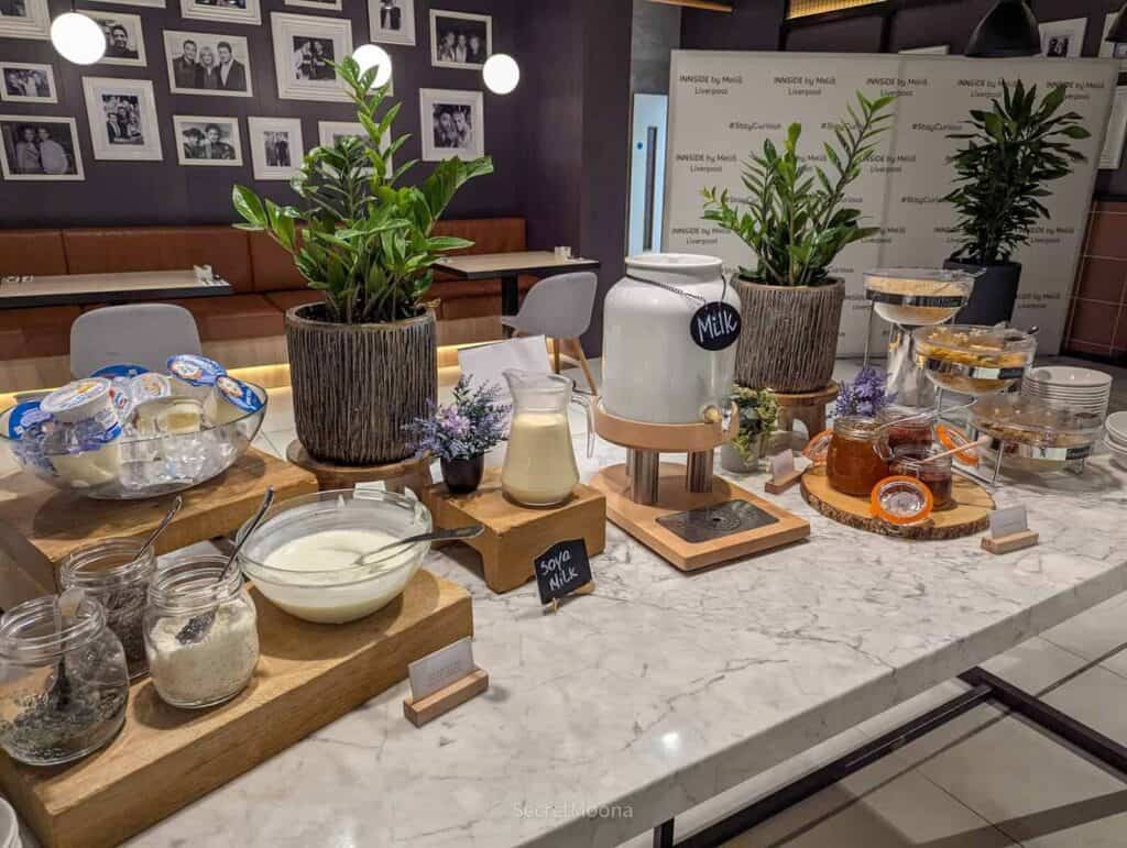Breakfast buffet with yoghurt, granola, milk and fruit at INNSiDE Liverpool